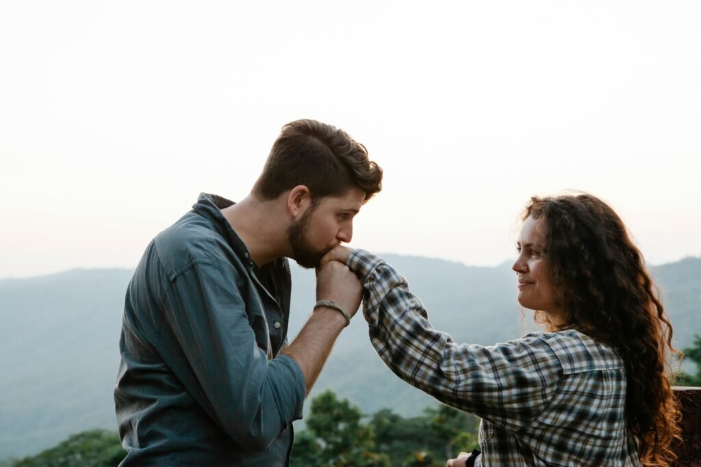 A couple enjoying a romantic moment with a serene landscape in the background, symbolizing love and togetherness.